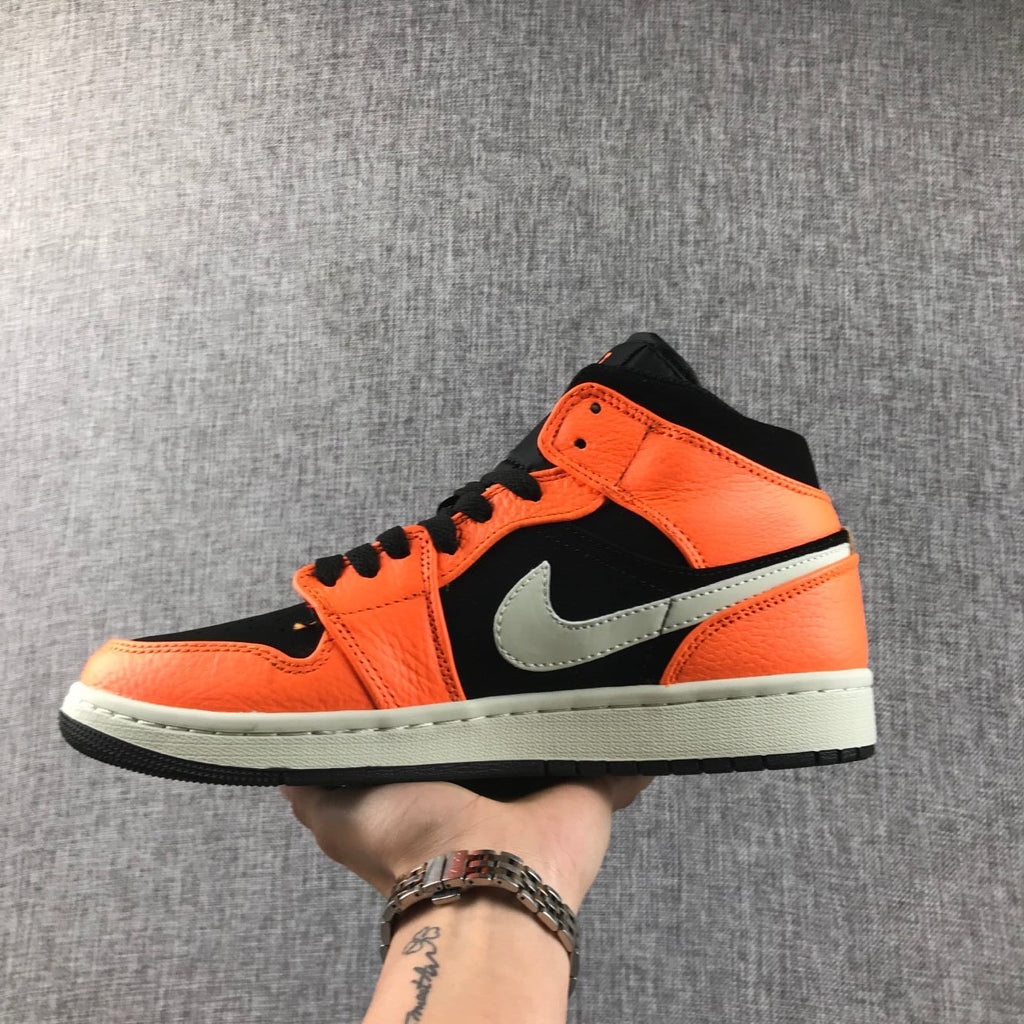 Air Jordan 1 Mid Shattered Backboard Sneakers, in Black and Orange - product image from the listing.