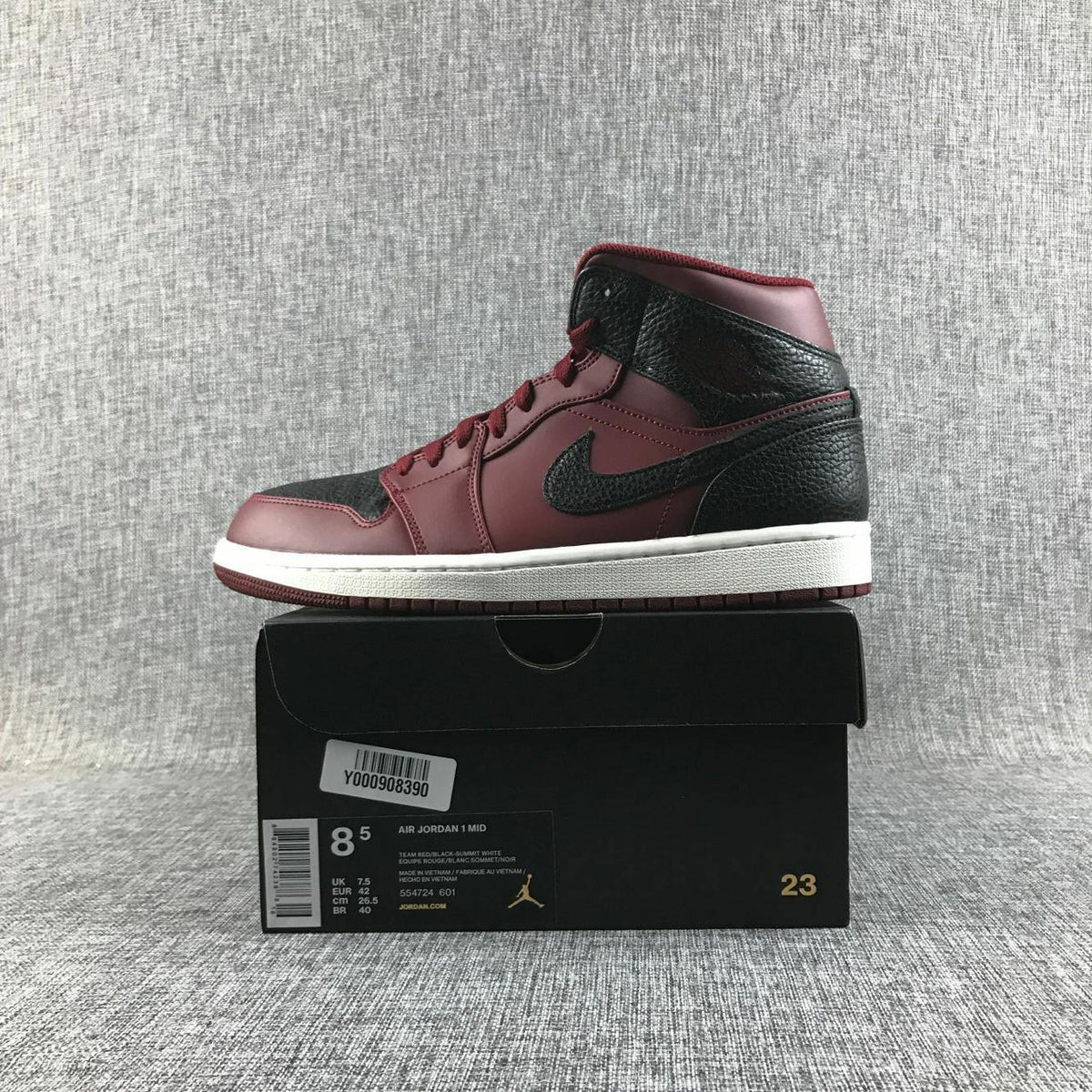 Air Jordan 1 Mid Sneakers in Black and Burgundy 554724-601 - product image from the listing.