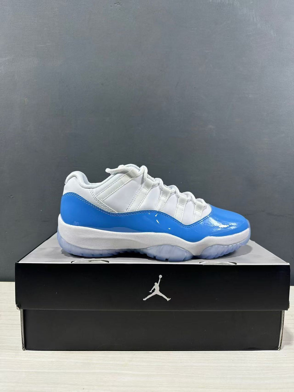 Air Jordan 11 Retro Low UNC Blue Sneakers FV5104-100 - product image from the listing.
