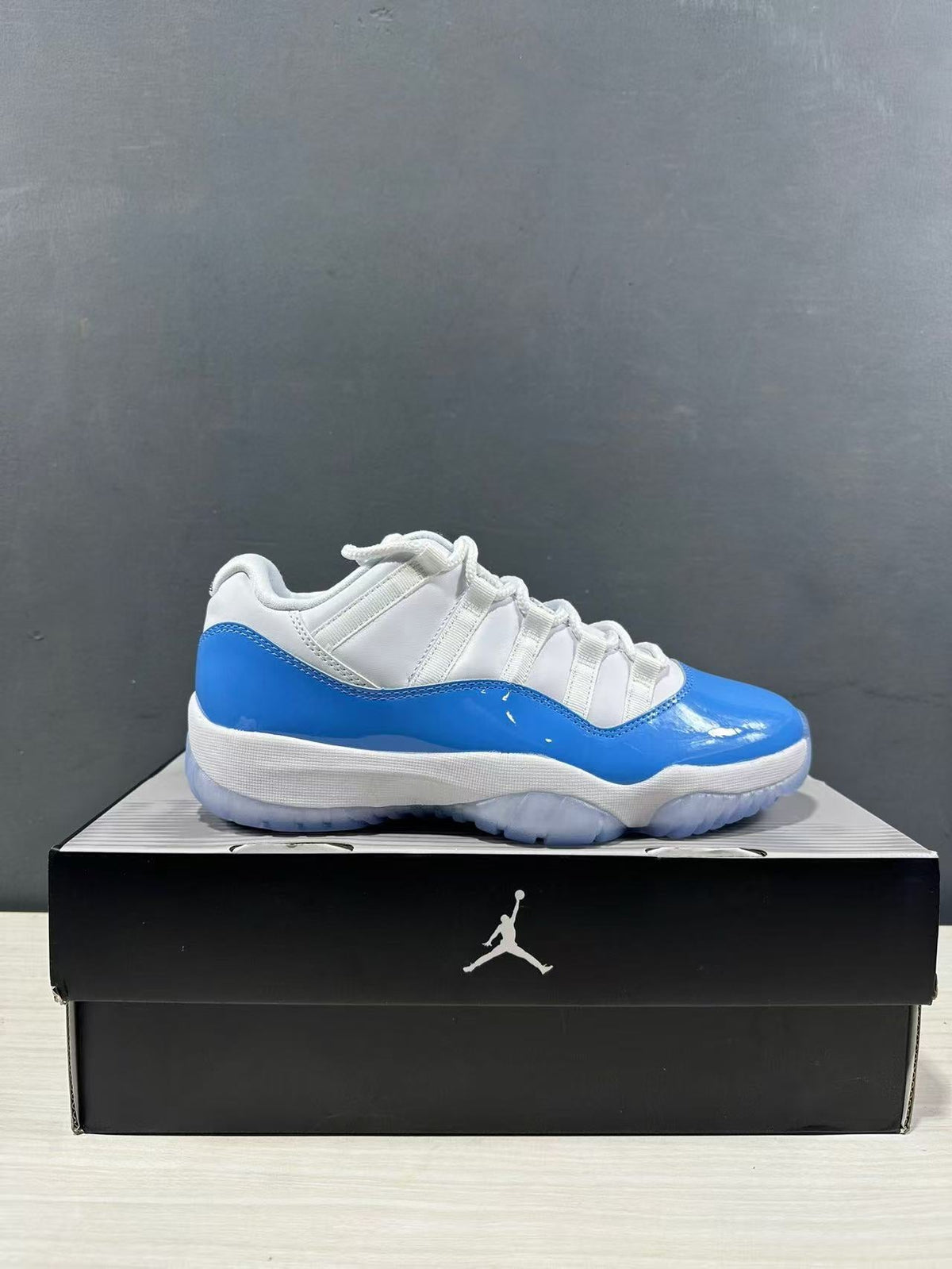 Air Jordan 11 Retro Low UNC Blue Sneakers FV5104-100 - product image from the listing.