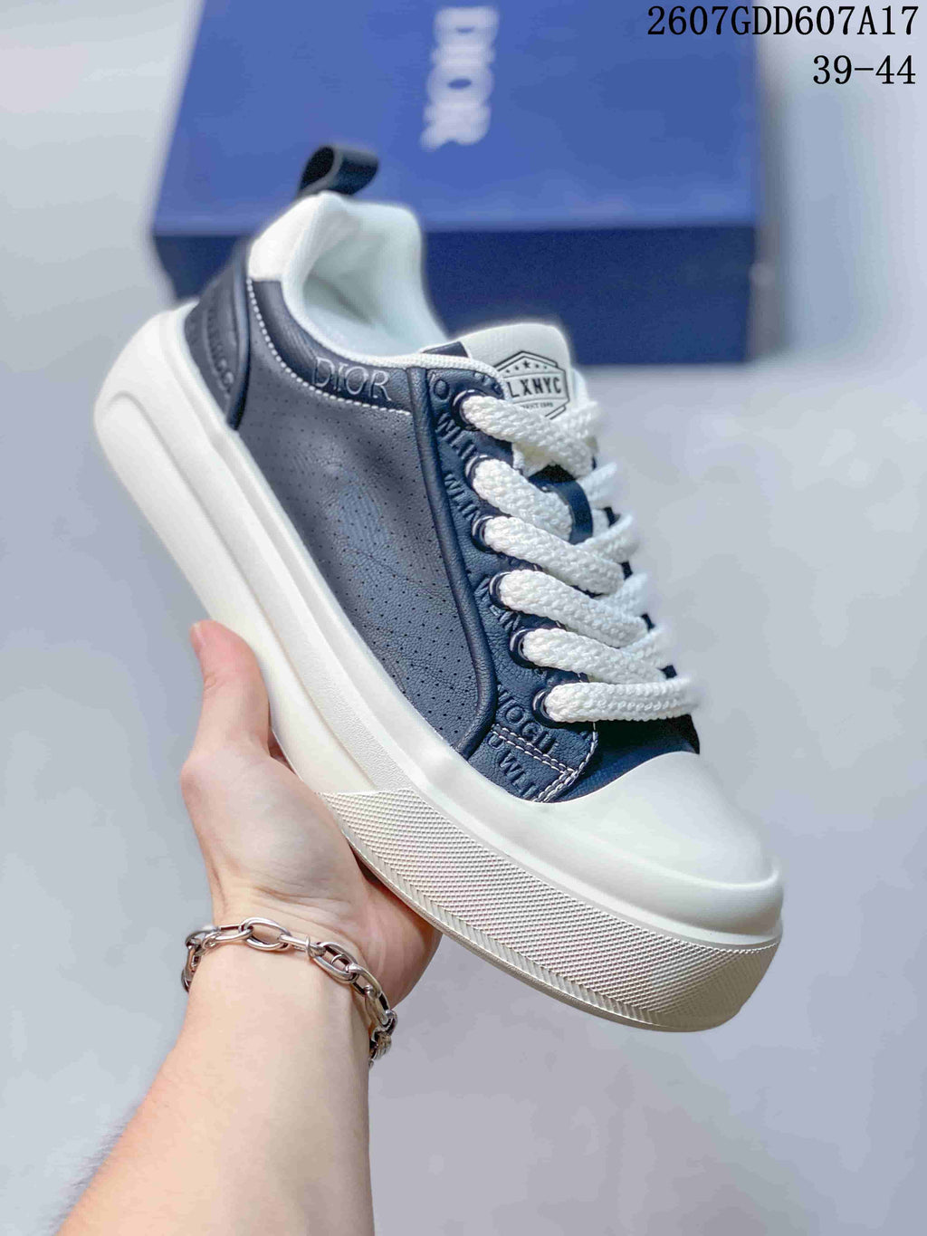 Dior Low-Top Sneakers in White and Navy 2607GDD607A17 - product image from the listing.