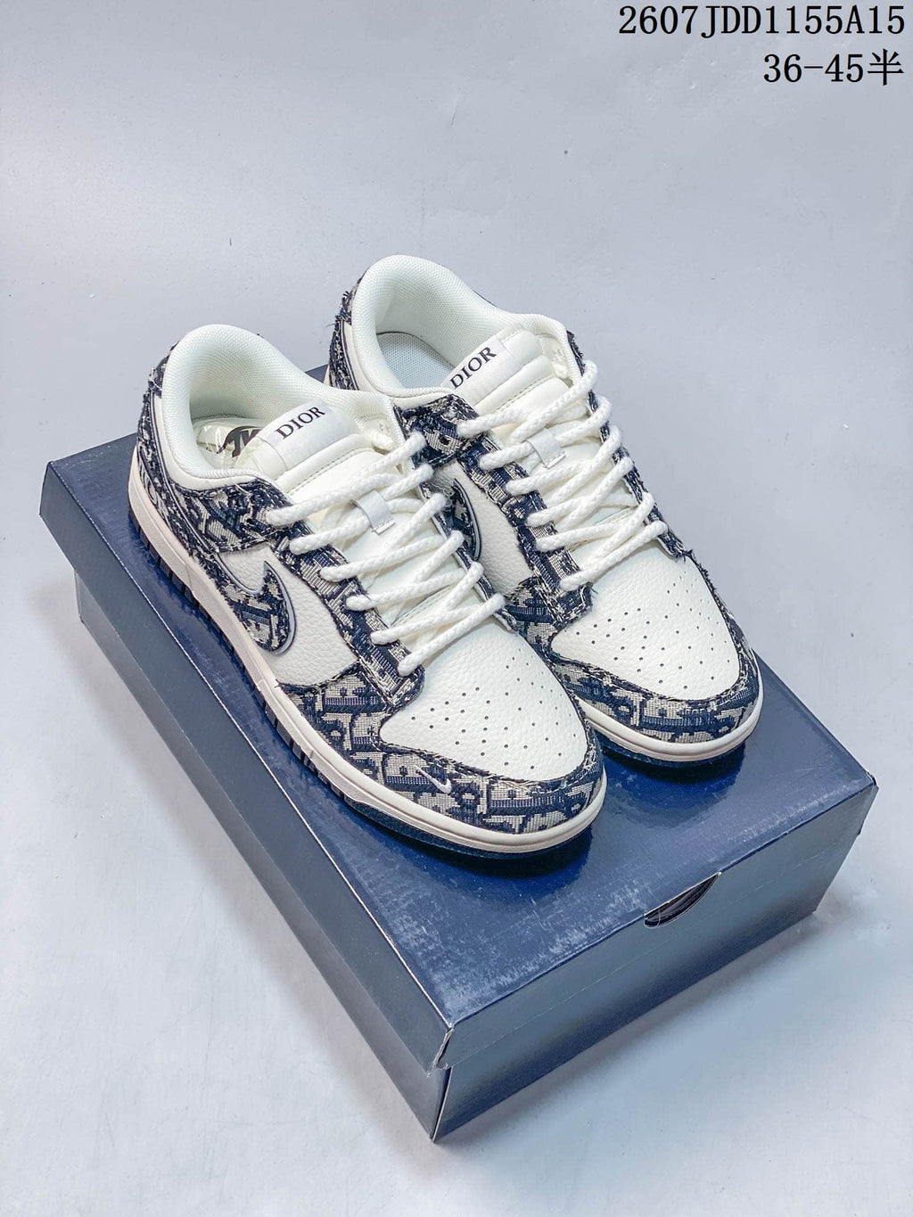 Nike SB Dunk Low Trainers in White, Gray and Navy Styles - product image from the listing.