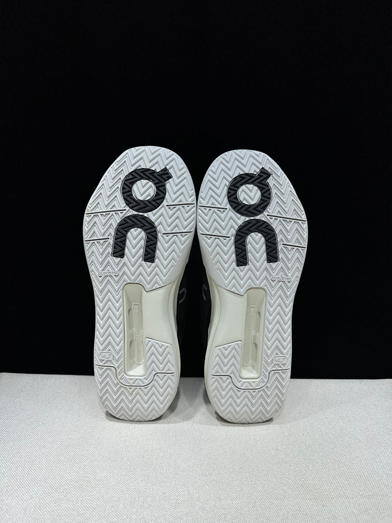 On THE ROGER Clubhouse Pro Tennis Sneakers in Black and White - product image from the listing.