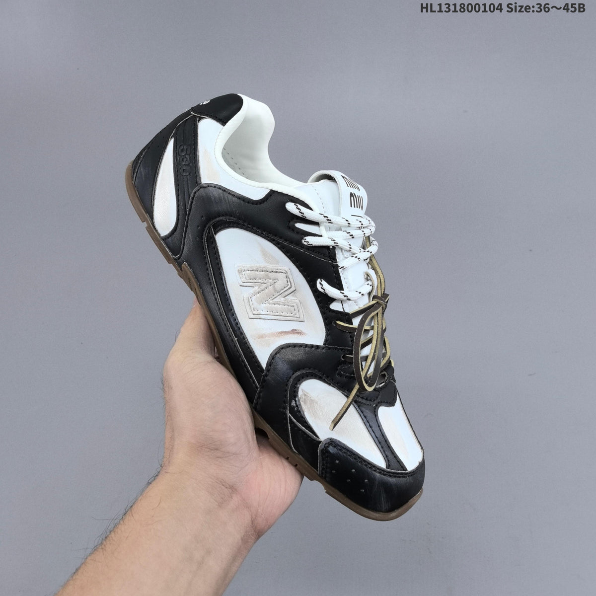 Black and White New Balance 530 SL Low-Top Sneakers - product image from the listing.