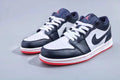 Jordan 1 Low Sneakers in Midnight Navy White Red - product image from the listing.