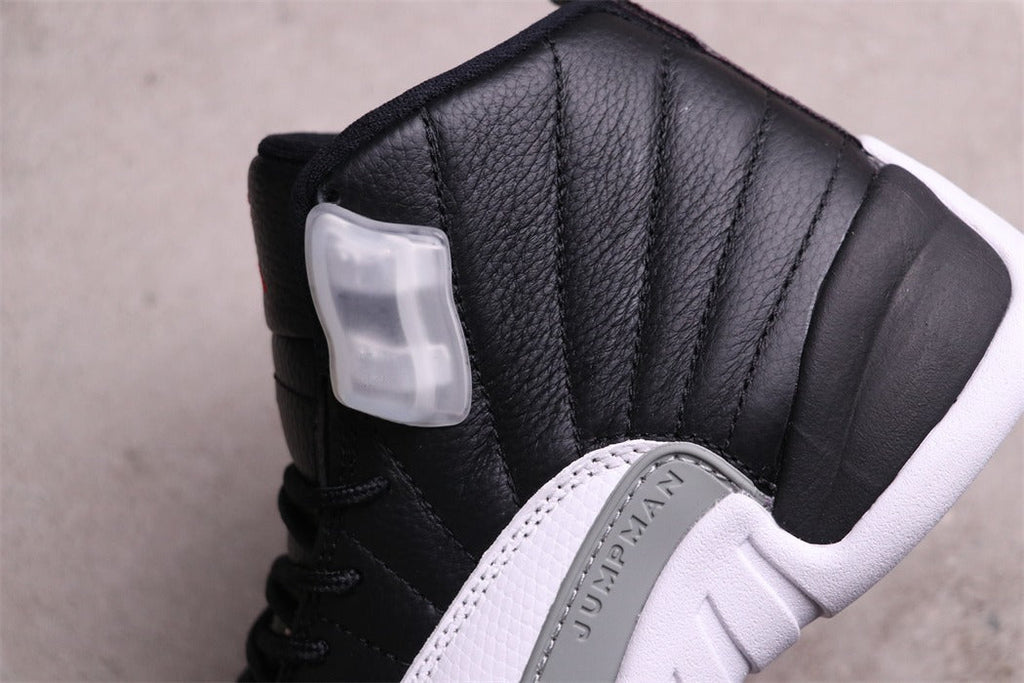 Air Jordan 12 Reverse Taxi Black White 130690-001 - product image from the listing.