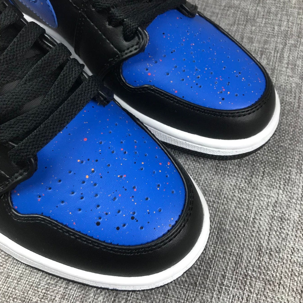 Air Jordan 1 Mid High-Top Sneakers in Black and Blue - product image from the listing.