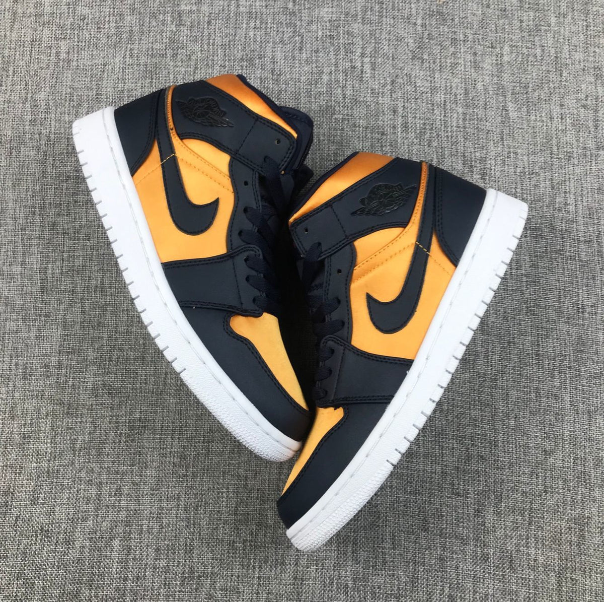 Air Jordan 1 Mid SE Sneakers in Black and Gold 852542-401 - product image from the listing.