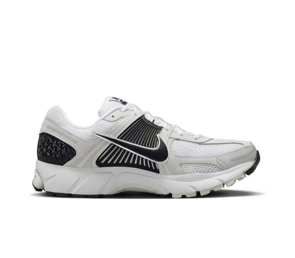 Nike Zoom Vomero 5 Sneakers in White and Black - product image from the listing.