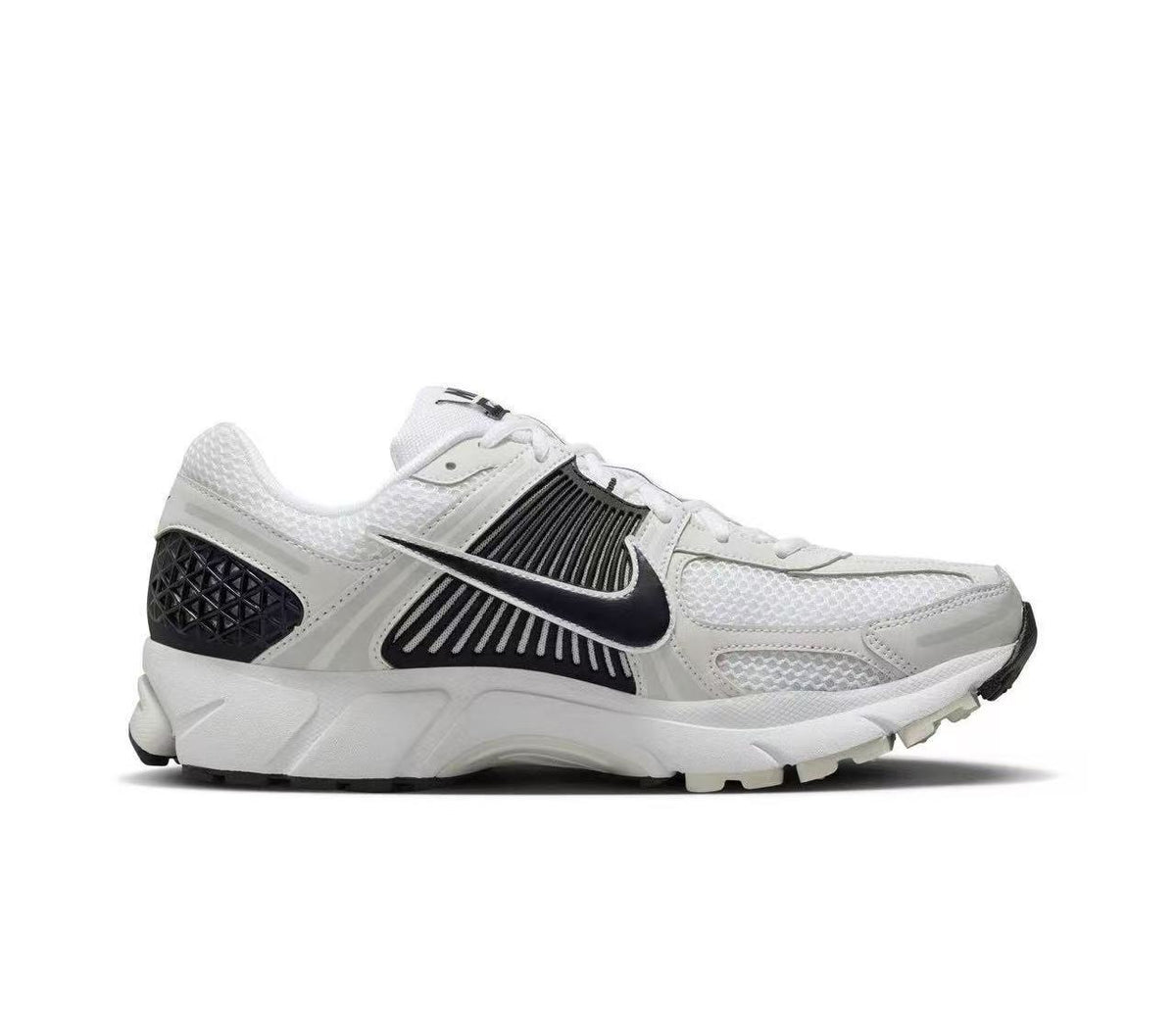 Nike Zoom Vomero 5 Sneakers in White and Black - product image from the listing.