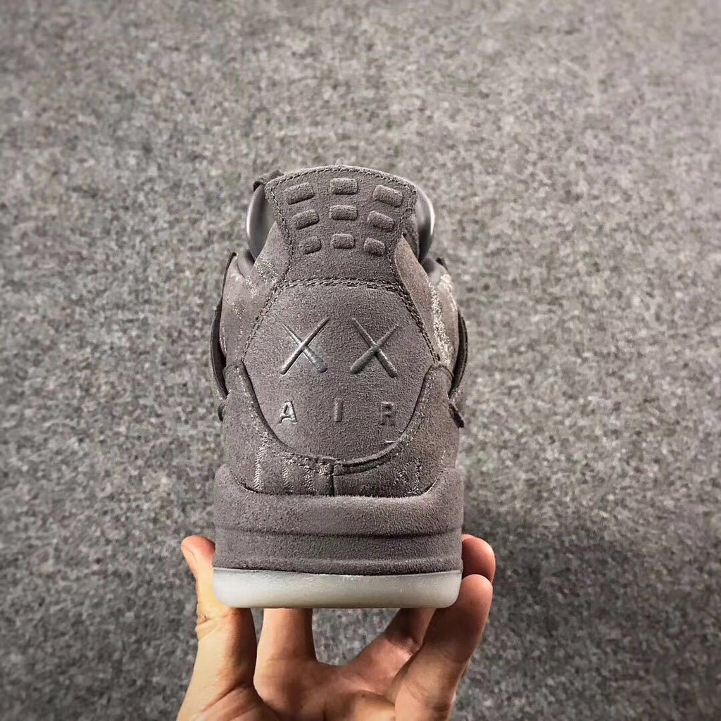 Grey Jordan 4 KAWS Sample High-Top Sneakers - product image from the listing.