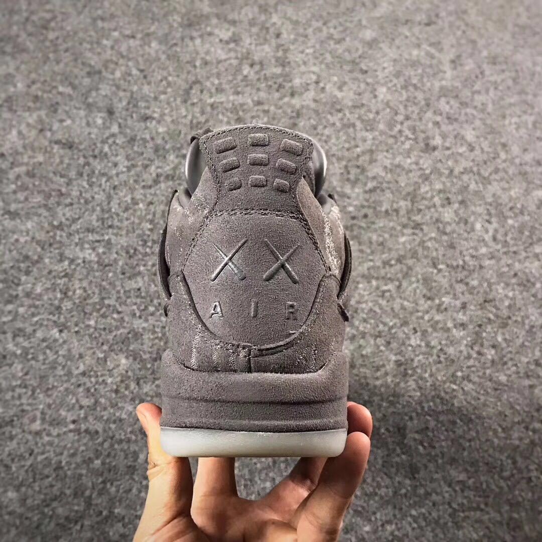 Grey Jordan 4 KAWS Sample High-Top Sneakers - product image from the listing.
