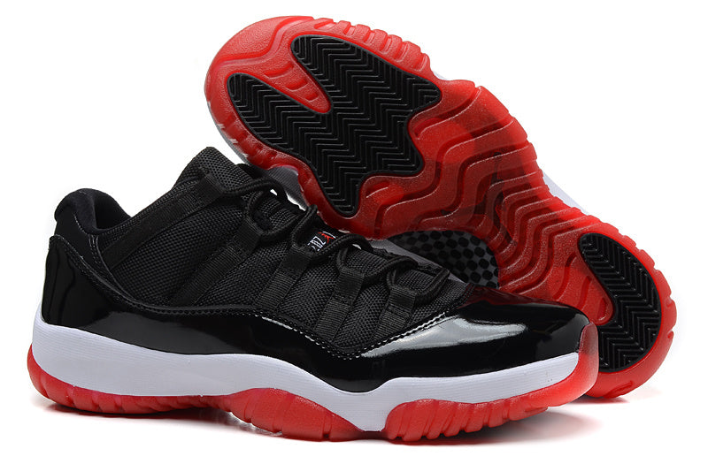 Air Jordan 11 Retro Low Black and Red Sneakers - product image from the listing.
