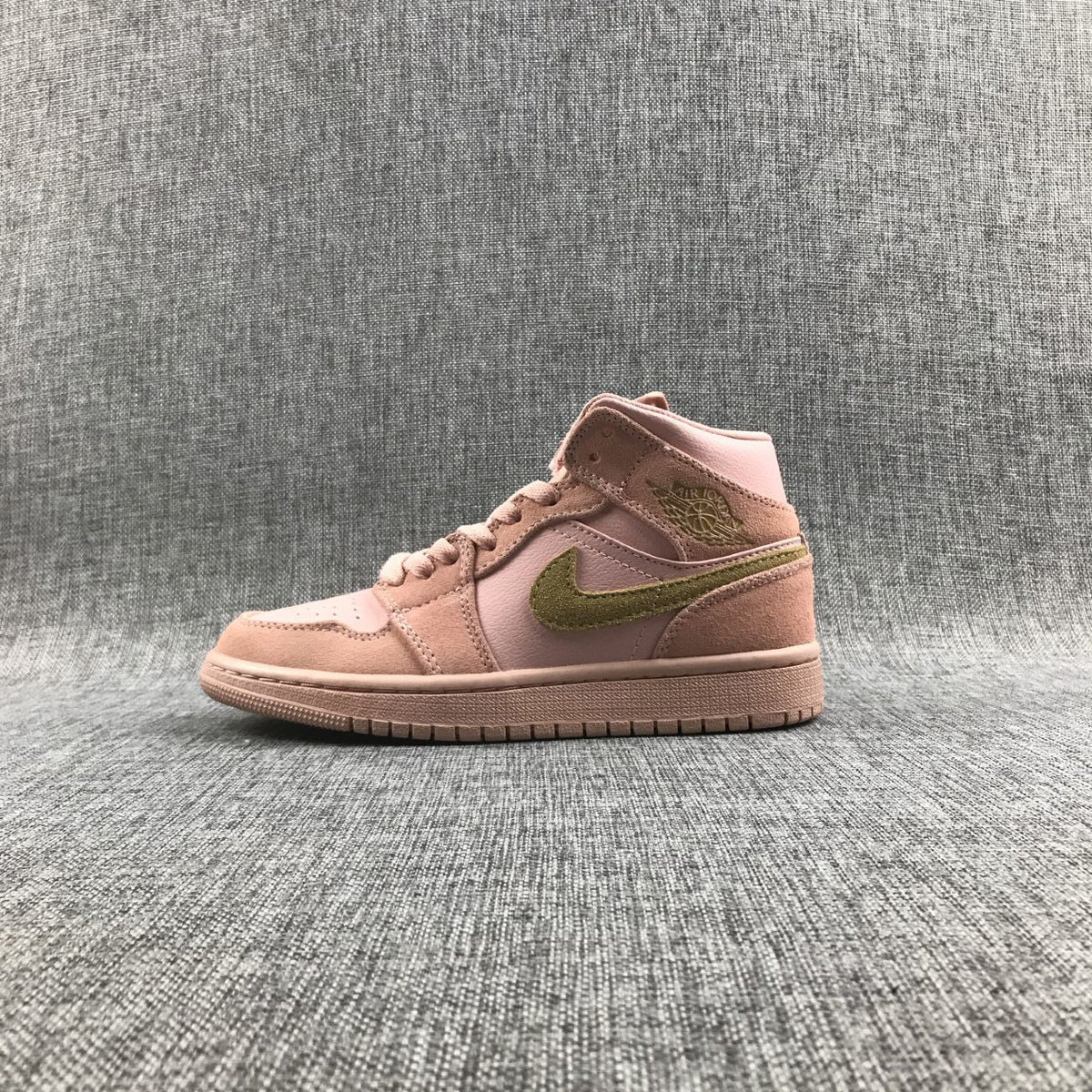 Jordan 1 Mid SE Sneakers in Pink 852542-600 - product image from the listing.