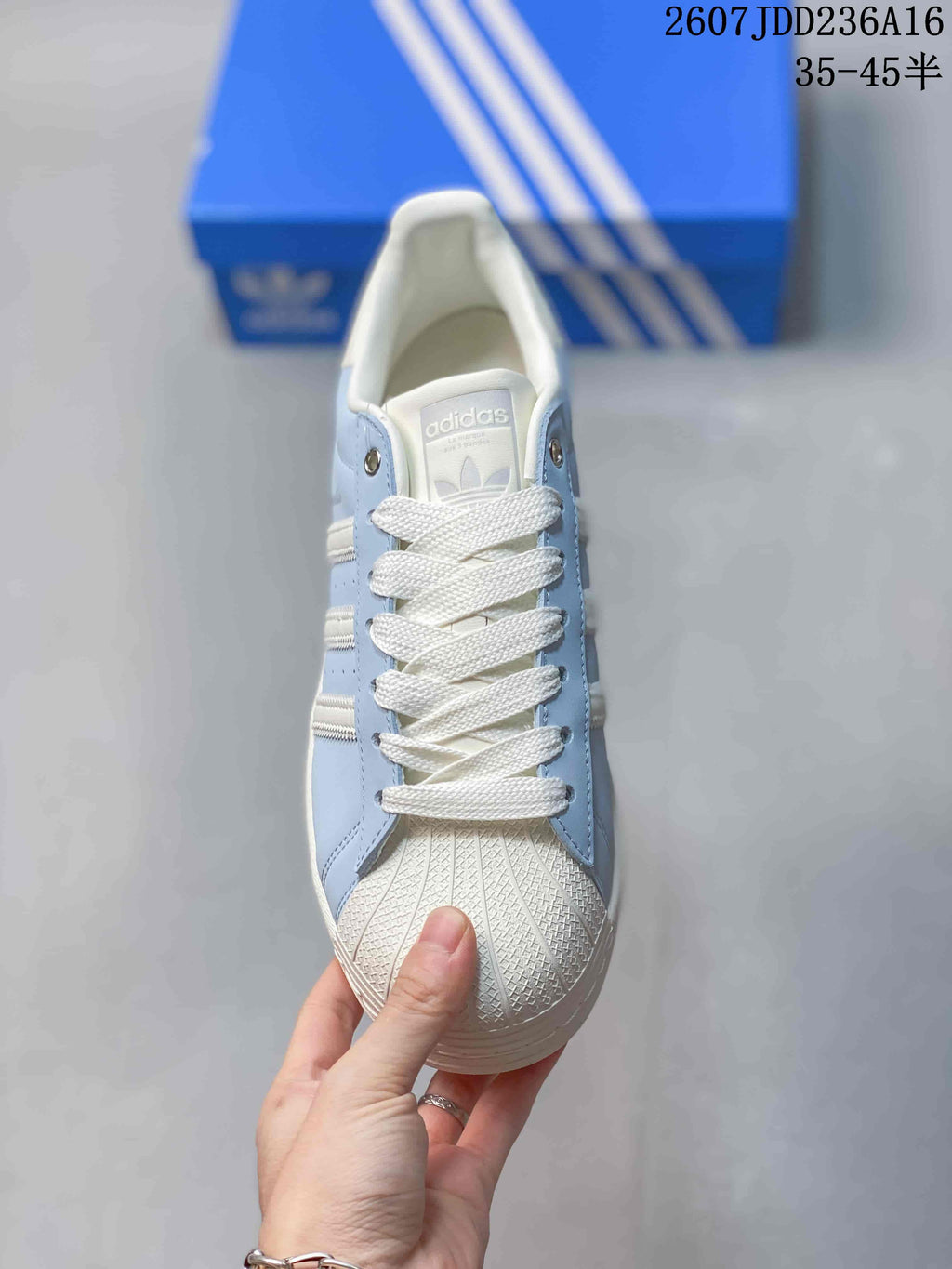 adidas Superstar Sneakers in Light Blue and White JDD236A16 - product image from the listing.