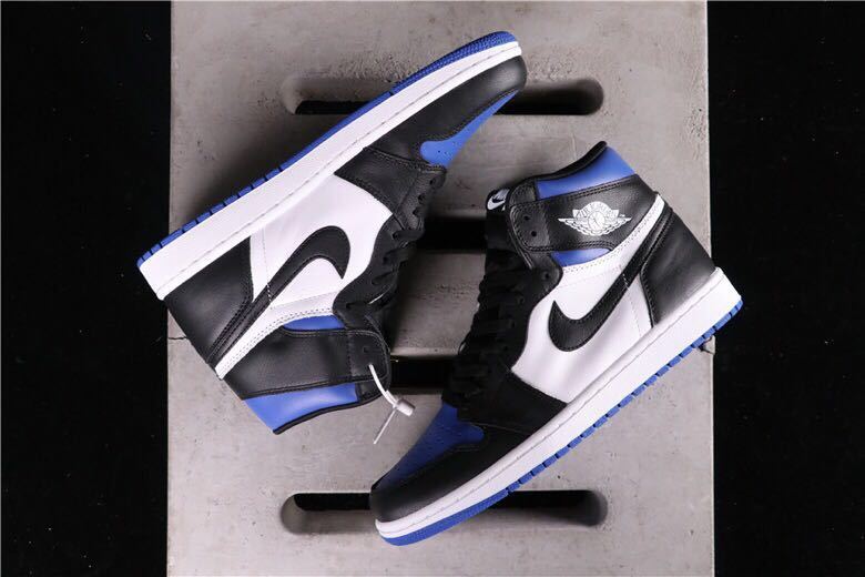 Air Jordan 1 Game Royal High-Top Sneakers in Black Blue White - product image from the listing.
