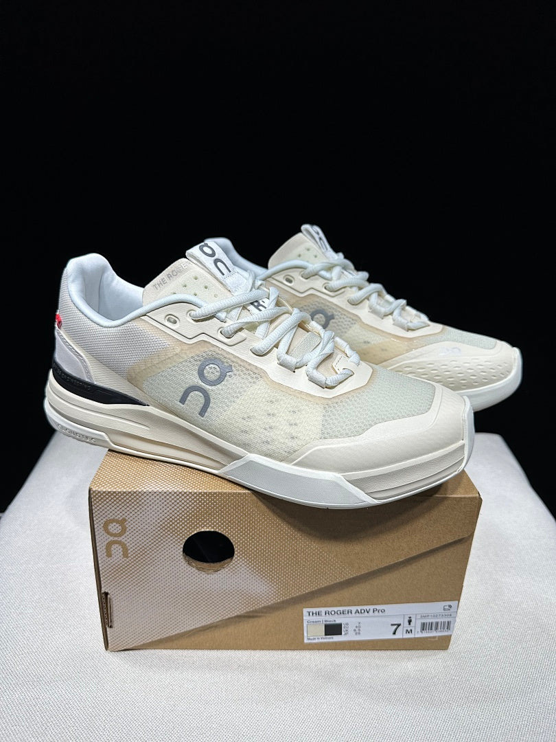 Cream and Black On The Roger Advantage Pro Sneakers - product image from the listing.