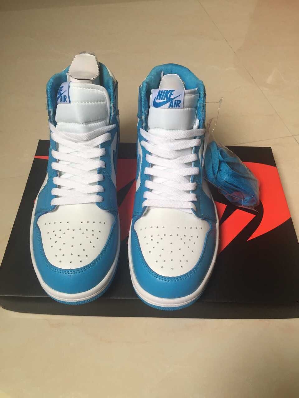 Jordan 1 High Sneakers in White and Blue - product image from the listing.