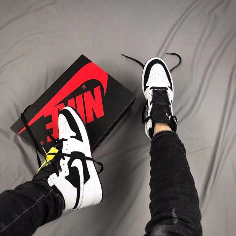 Air Jordan 1 High Sneakers in Black and White - product image from the listing.