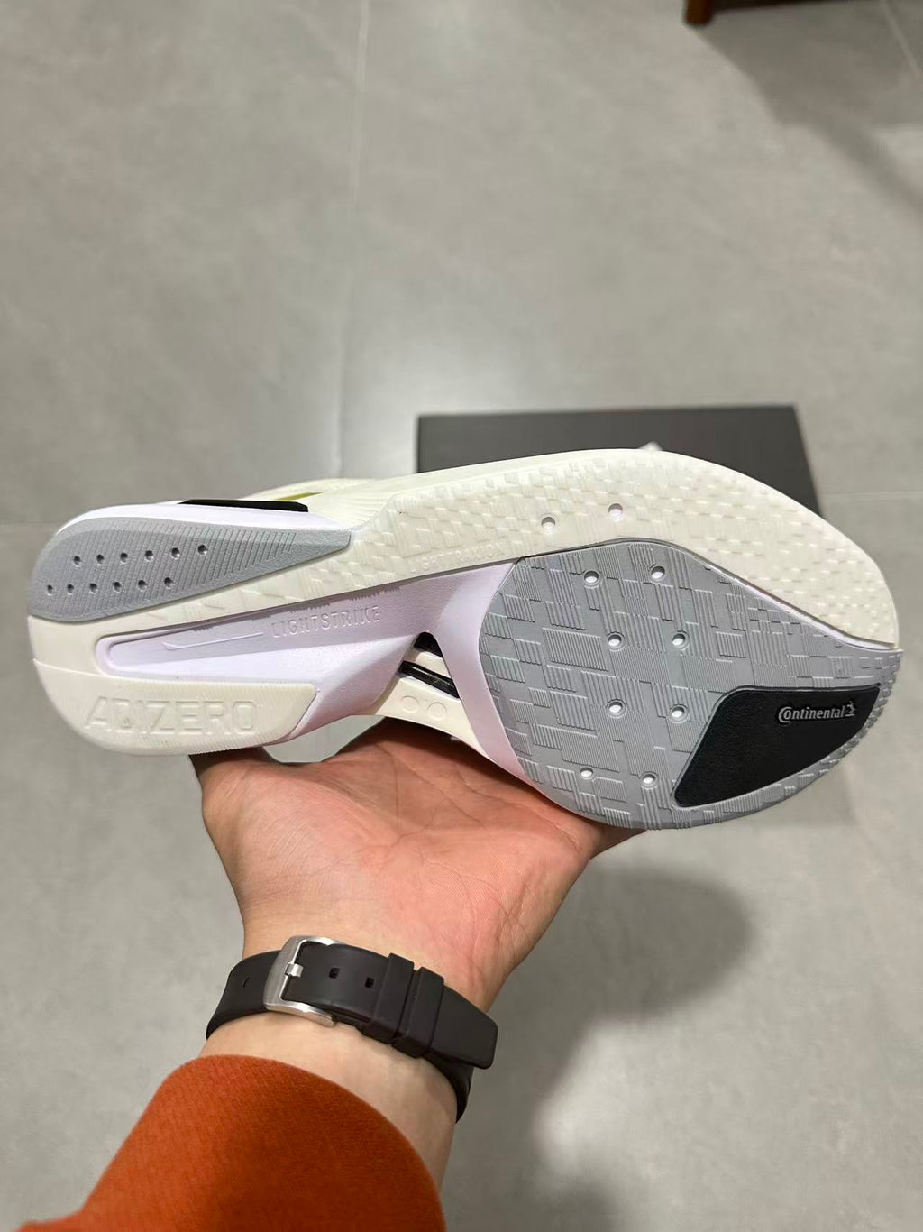 Adizero Lightstrike Pro Running Shoes in White and Olive JS4947 - product image from the listing.