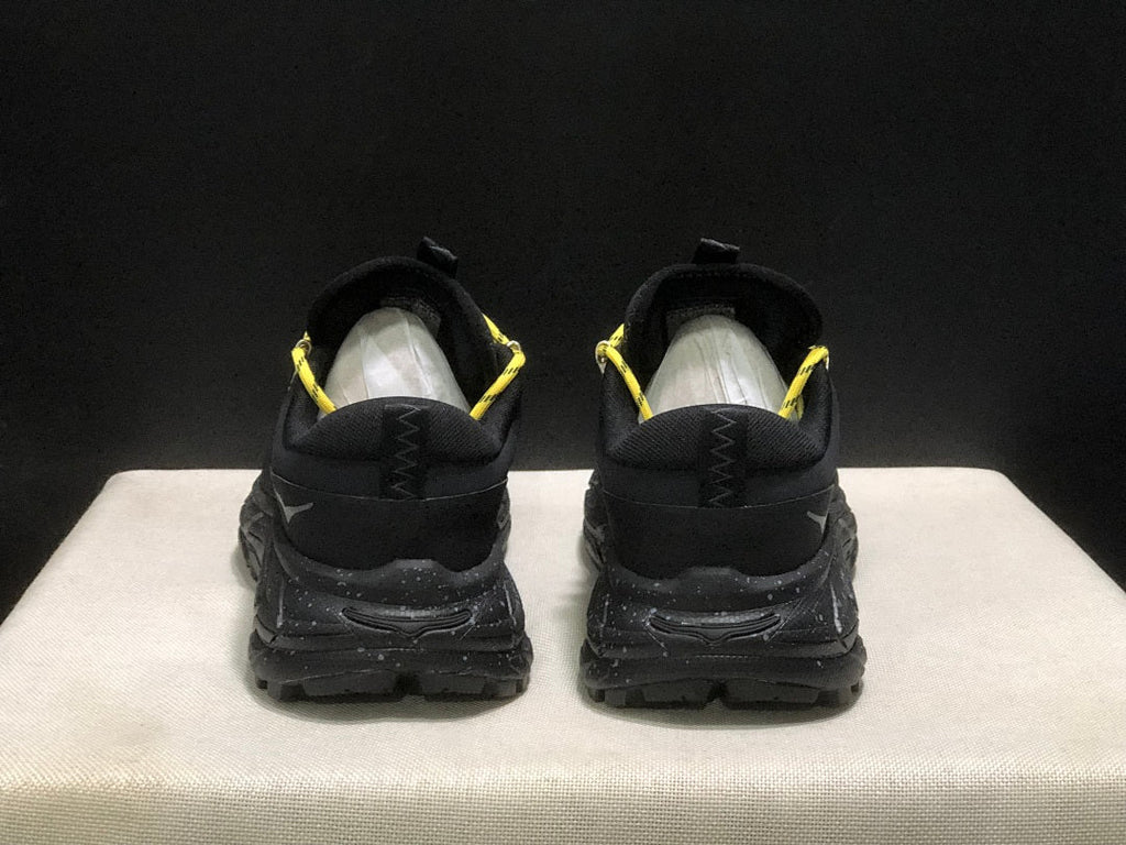 HOKA Tor Summit Trail Sneakers in Black and Yellow - product image from the listing.