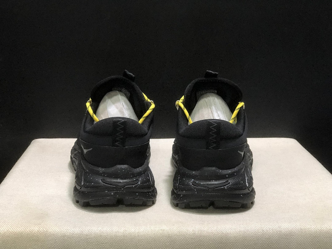 HOKA Tor Summit Trail Sneakers in Black and Yellow - product image from the listing.