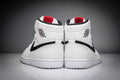Air Jordan 1 High Sneakers in White and Black - product image from the listing.