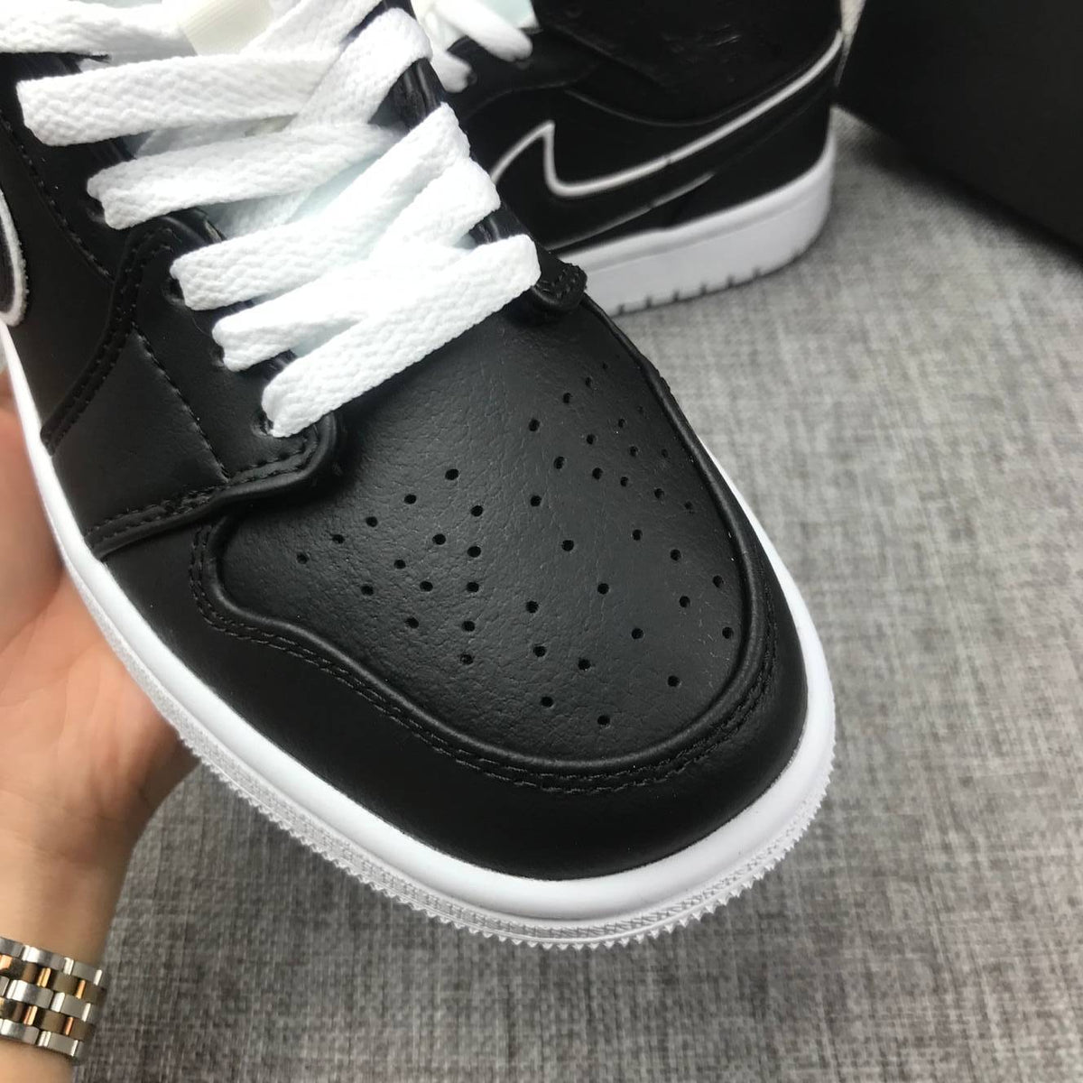 Air Jordan 1 Mid Sneakers in Black and White 852542-016 - product image from the listing.