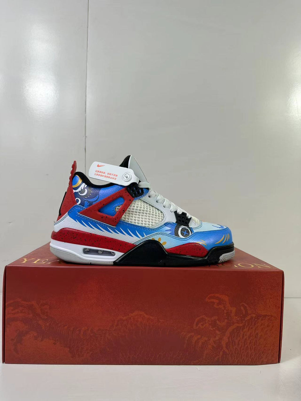 Air Jordan 4 Chinese New Year Red Blue Sneakers DH6927-161 - product image from the listing.