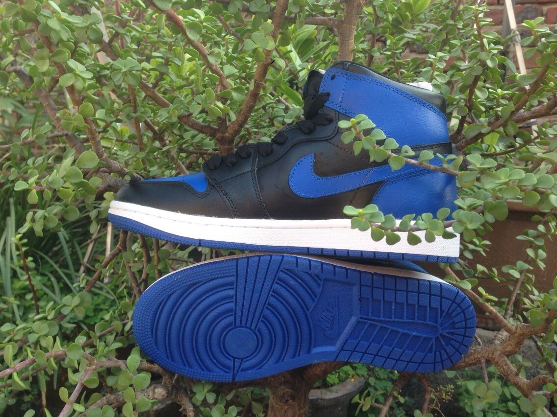 Jordan 1 High Basketball Sneakers in Blue and Black - product image from the listing.