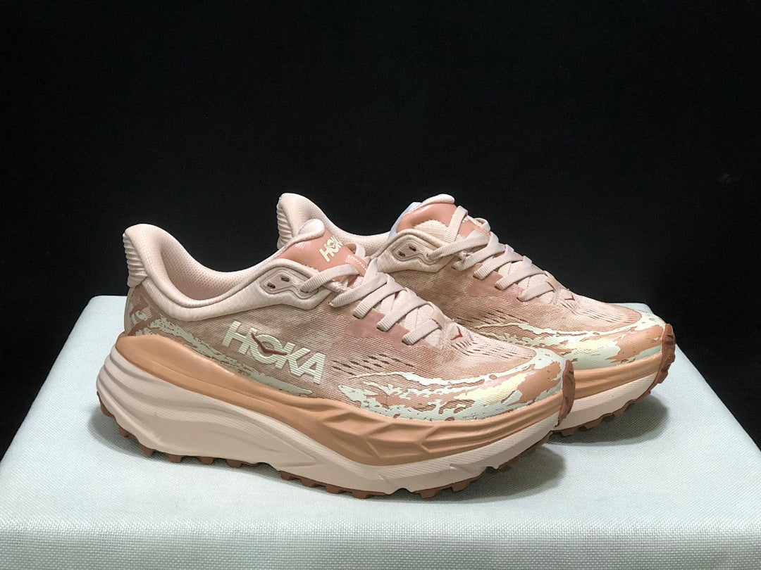 HOKA Stinson 7 Trail Running Shoes in Blush and in Cream - product image from the listing.