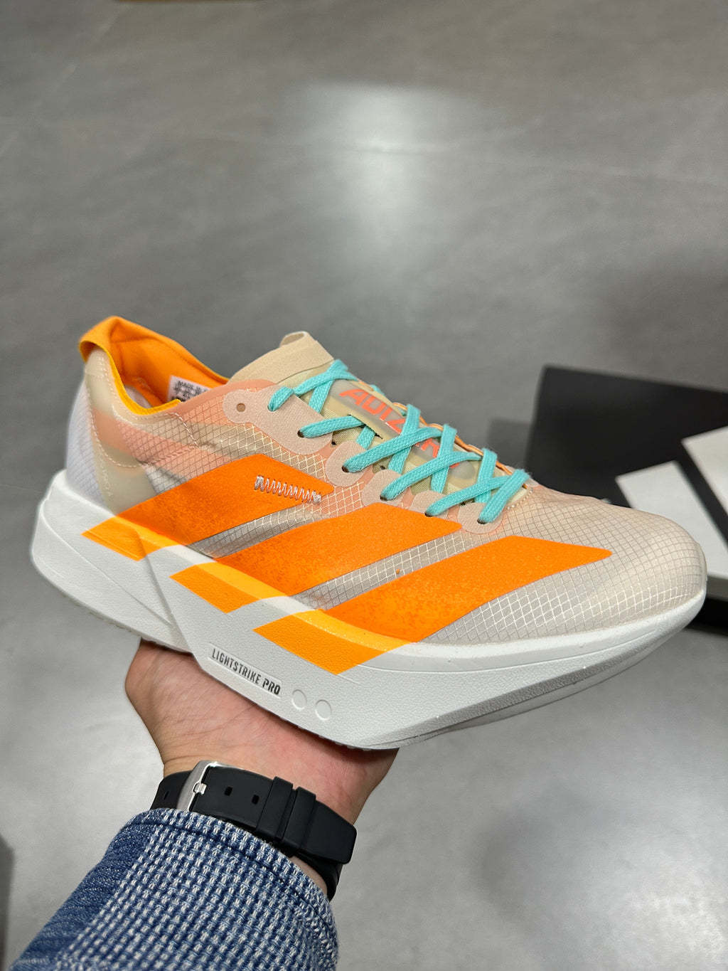 Nike Lightstrike Pro Running Shoes in White Orange Turquoise - product image from the listing.
