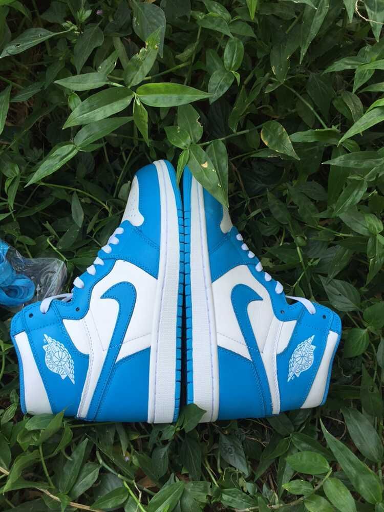Blue and White Air Jordan 1 High Sneakers - product image from the listing.