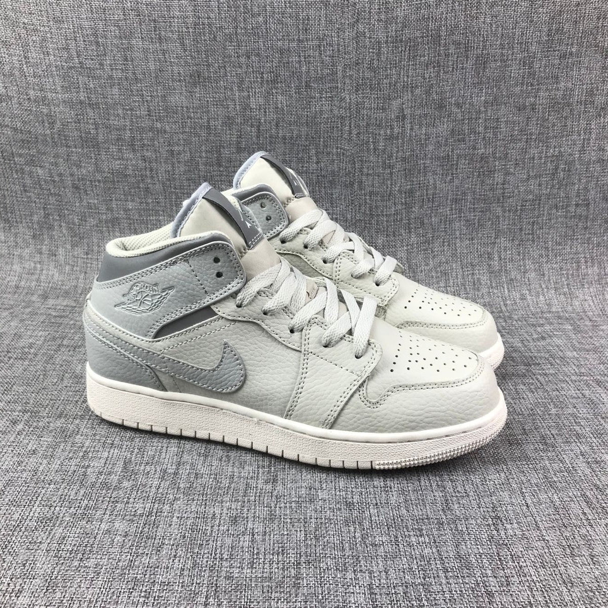 White and Grey Air Jordan 1 Mid Sneakers - product image from the listing.