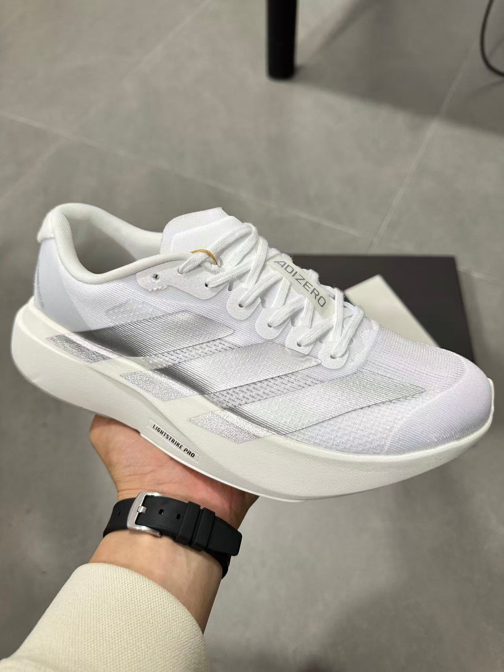 adidas Lightstrike Pro Running Shoes in White JR6207 - product image from the listing.