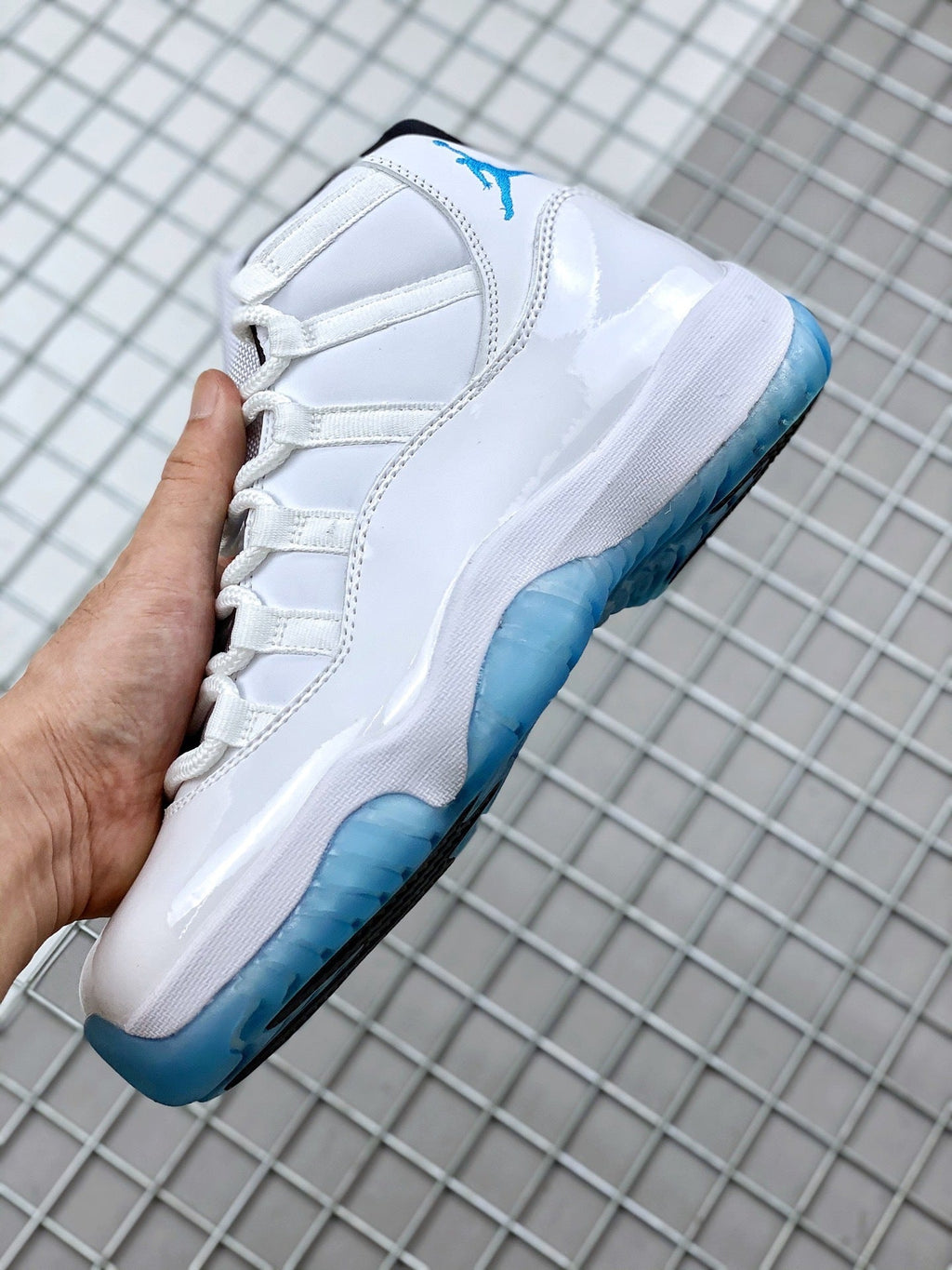 Jordan 11 Legend Blue Sneakers in White Blue 378037-117 - product image from the listing.