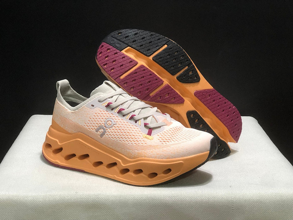 On Cloudsurfer Max Shoes for Running in Pearl and Tangerine - product image from the listing.