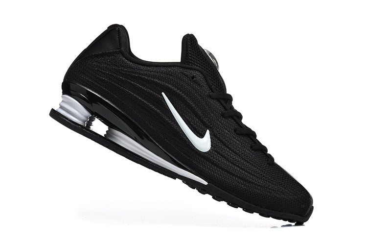 Nike Low-Top Sneakers in Black and White - product image from the listing.
