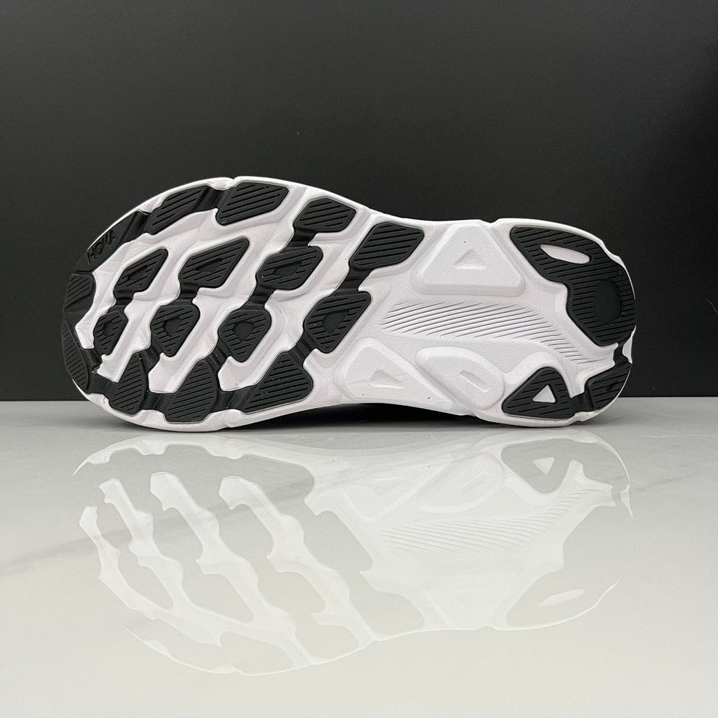 HOKA Clifton 9 Running Shoes in Black and White - product image from the listing.