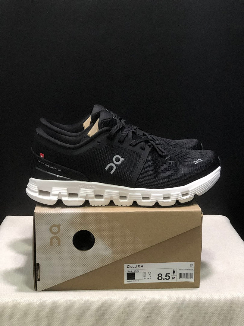 On Cloud X 4 Sneakers in Black and White - product image from the listing.