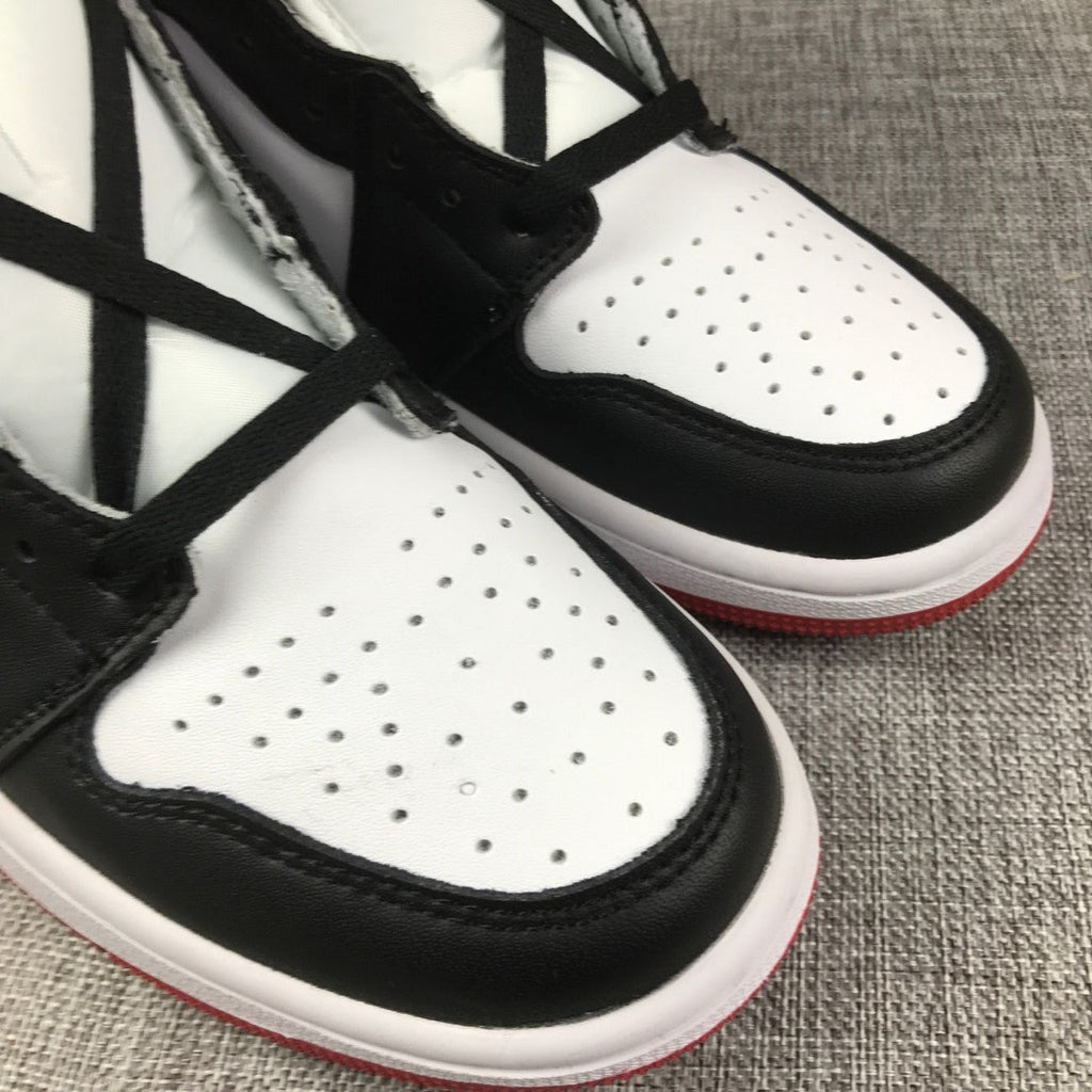 Black Toe Sneakers - Air Jordan 1 High 555088-184 - product image from the listing.