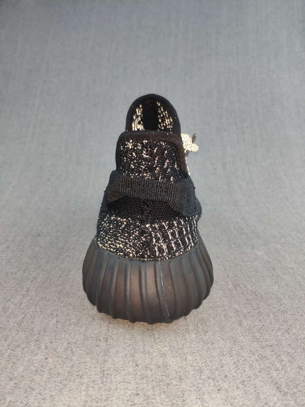 Black and Cream Yeezy 350 V2 Knit Sneakers - product image from the listing.