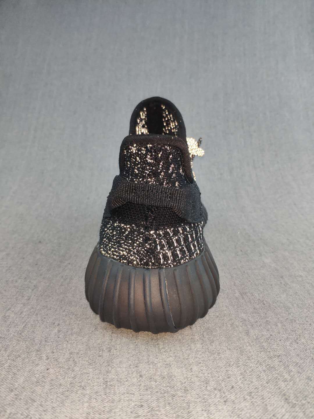 Black and Cream Yeezy 350 V2 Knit Sneakers - product image from the listing.