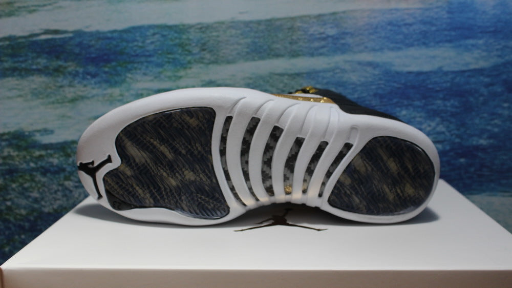 Air Jordan 12 Wings Black White Gold Sneakers 848692-033 - product image from the listing.