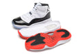 Air Jordan 11 Retro High White and Black Sneakers - product image from the listing.