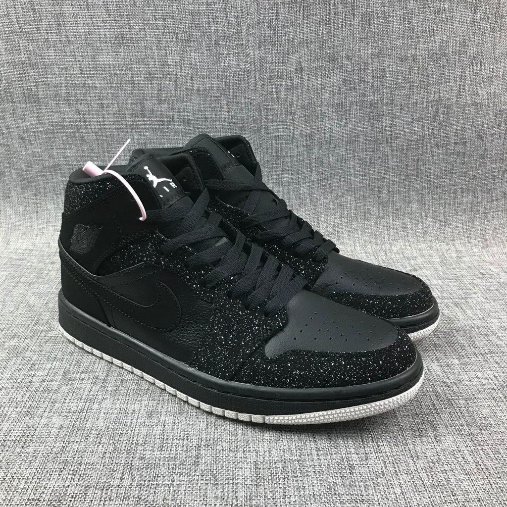 Air Jordan 1 Mid Black and White Sneakers 554724-001 - product image from the listing.