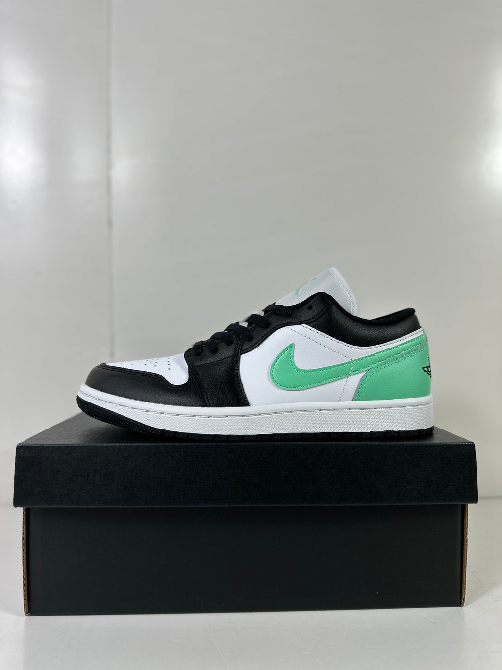 Air Jordan 1 Low White Green Black Sneakers 553558-131 - product image from the listing.
