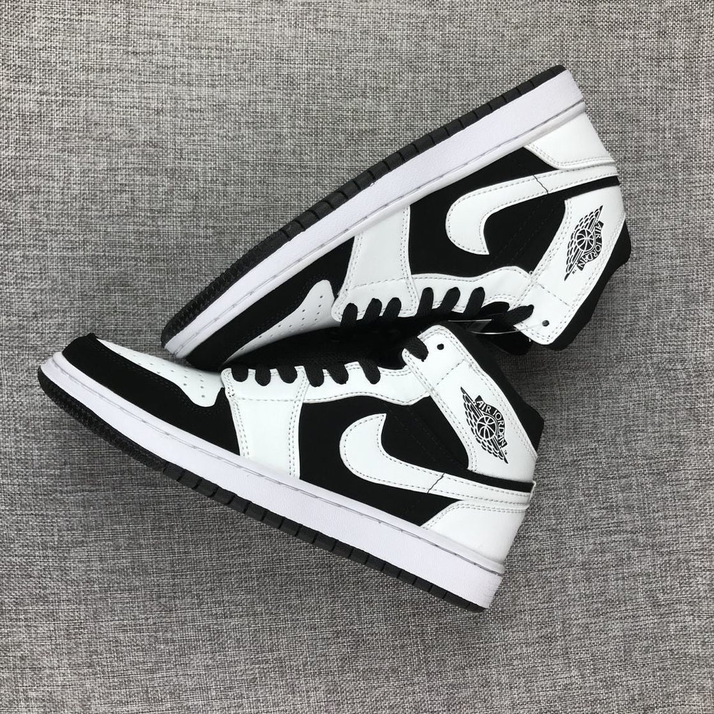 Air Jordan 1 Mid Black White Sneakers 554724-113 - product image from the listing.