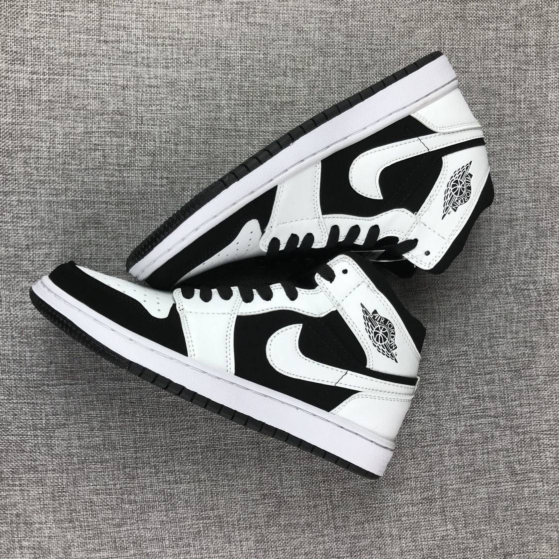 Air Jordan 1 Mid Black White Sneakers 554724-113 - product image from the listing.