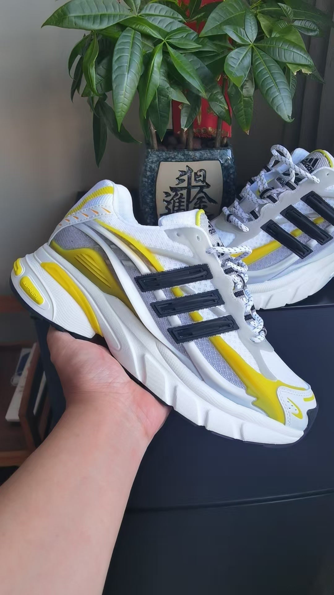 White and Yellow Mesh Trainers with Black Side Stripes - product image from the listing.
